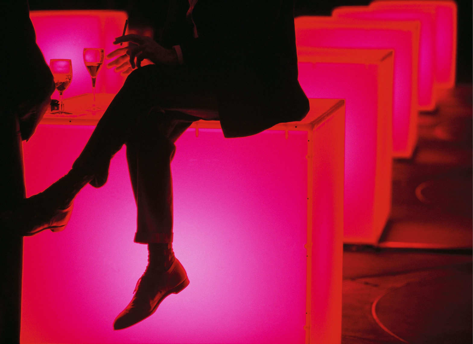 Man on glowing table at Guggenheim party